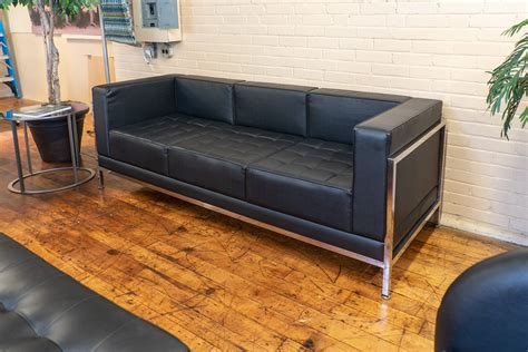 Mid-Century Modern Black Leather Sofa • Peartree Office Furniture