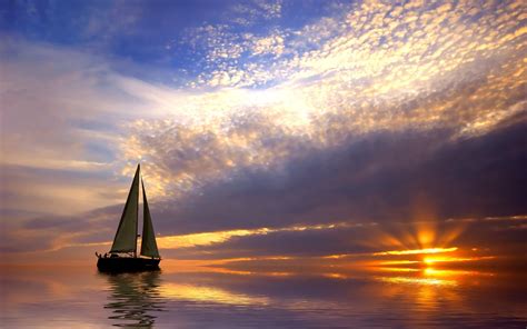 Sailing boat in the calm sea at sunset wallpapers and images - wallpapers, pictures, photos