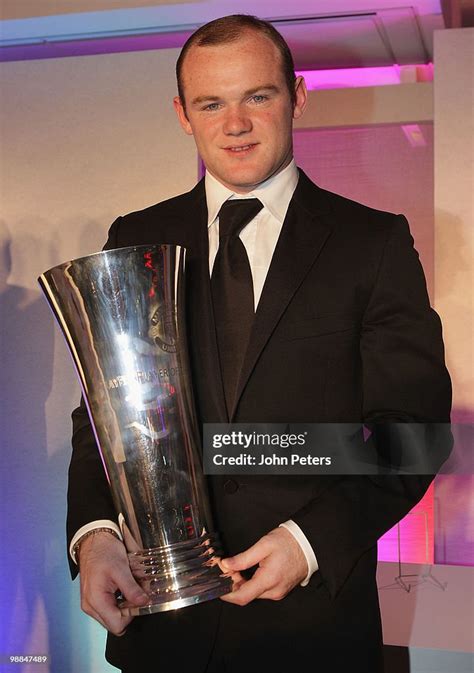 Wayne Rooney of Manchester United poses with the Players' Player of... News Photo - Getty Images