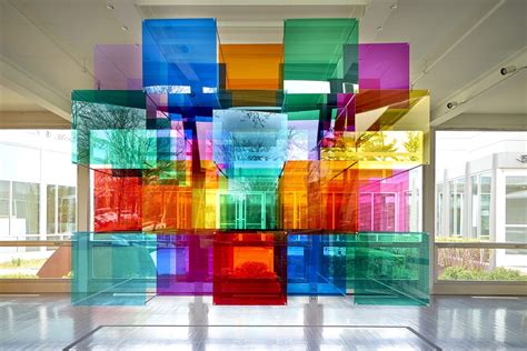 Light Shines Through a Rainbow-Tinted Geometric Panel Installation by ...