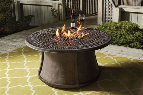 Burnella Round Outdoor Fire Pit Table from Ashley | Coleman Furniture