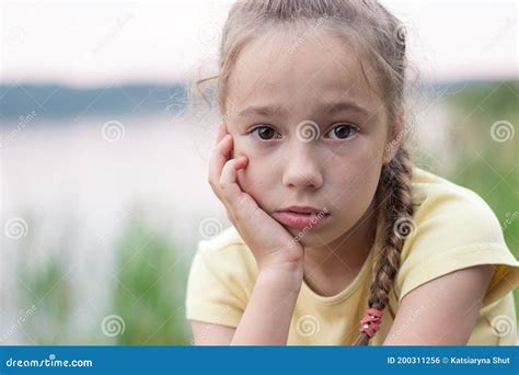 Sad Little Girl is Crying and Looking with Serious Face at Camera Stock Photo - Image of child ...