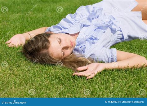 Beautiful Girl Lying Down Of Grass Stock Images - Image: 16430374