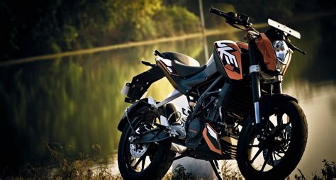 Download KTM Duke 390 Near Lakeshore Wallpaper | Wallpapers.com