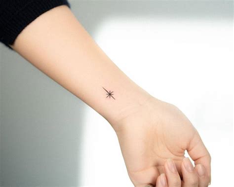 Minimalist north star tattoo on the wrist