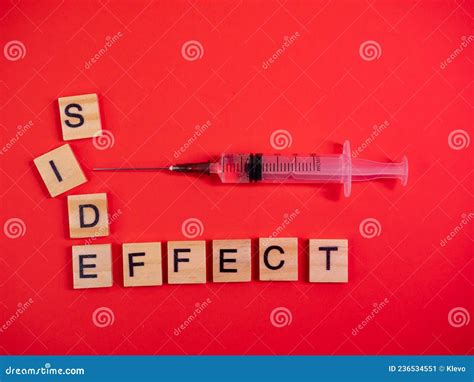 Syringe Filled with Solution. Words Side Effect on Colored Red Paper Texture Background. Concept ...