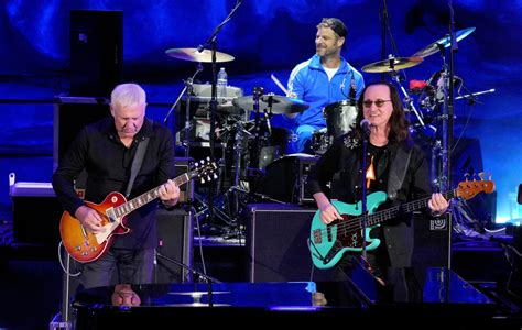 Watch Rush's Geddy Lee and Alex Lifeson reunite onstage to perform ...