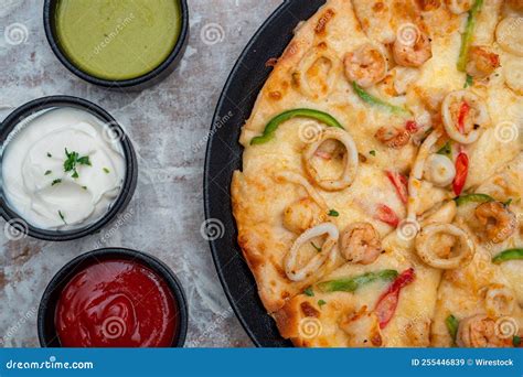 Top View of a Seafood Pizza with Sauces Stock Image - Image of sauce, view: 255446839