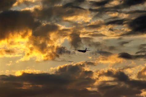 Silhouette of an Airplane Flying at Sunset Clouds. Stock Photo - Image of airport, airline ...