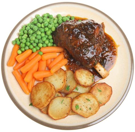 Roast Lamb Shank Dinner stock photo. Image of gravy, peas - 15507386