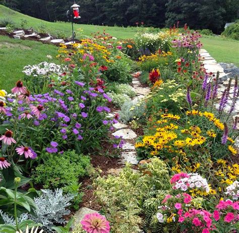 Photo of the Week: A customer's garden in FULL bloom. How many varieties can you name ...