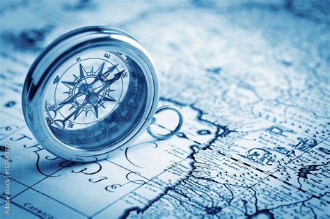 antique compass on vintage map background Stock Photo | Adobe Stock