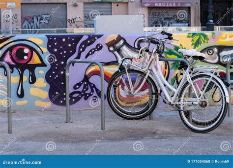 Bicycle on the Background of a Wall with Graffiti Editorial Stock Photo - Image of urban, cycle ...