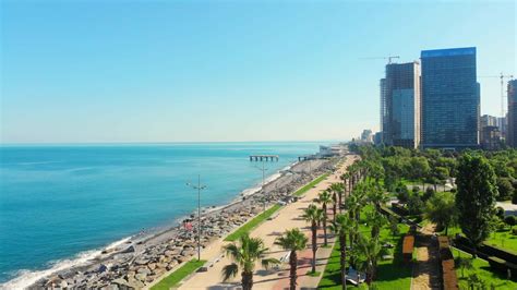 Aerial panoramic view of beautiful Batumi beach in sunny summer weather. Batumi is capital of ...