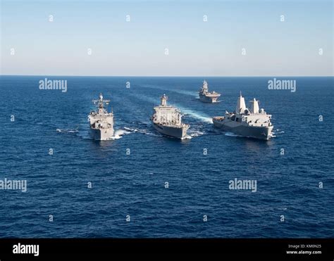 The U.S. Navy Harpers Ferry-class amphibious dock landing ship USS Oak Hill (left), U.S. Navy ...