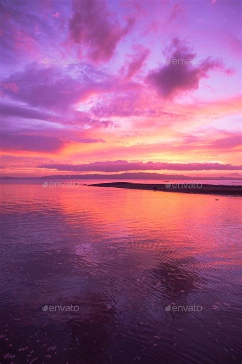 Pink purple sky during sunset over water background vertical Stock ...