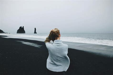 Woman Wearing Sweater Standing in Front of Beach · Free Stock Photo