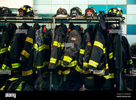 Firefighter uniforms and helmets in fire station, New York, United States Stock Photo - Alamy