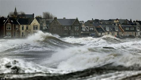 Storms red alert: Britain's coast battered by 30ft waves, high tides, giant hailstones as one of ...