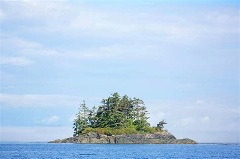 Small Island In Ocean Photograph by Grant Faint