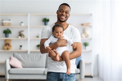 Fatherhood Concept. Happy Young Black Man Holding Cute Newborn Baby in Hands Stock Image - Image ...