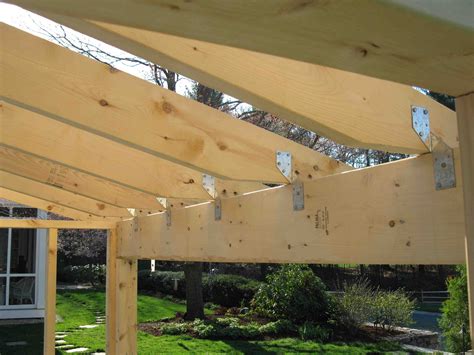 a wooden structure in the middle of a yard