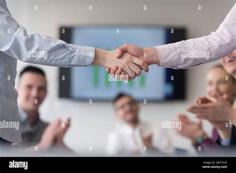 Business womans handshake Stock Photo - Alamy