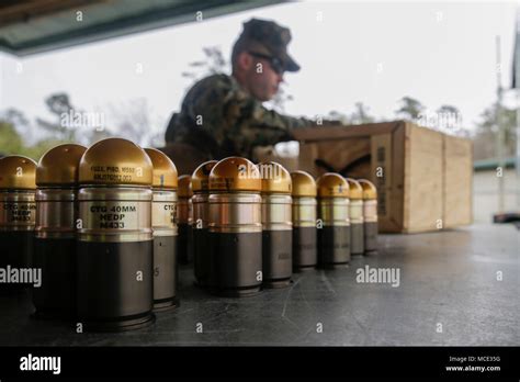 40mm High Explosive rounds are staged in preparation for a grenade launcher range hosted by ...