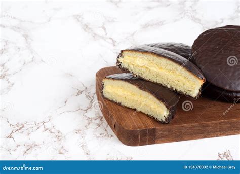 Custard Cream Filled Chocolate Sponge Cake Stock Photo - Image of slices, cake: 154378332