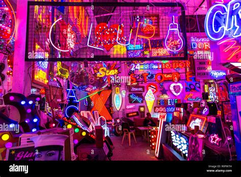 Room full of bright colourful neon signs, neon shop Gods Own Junkyard ...