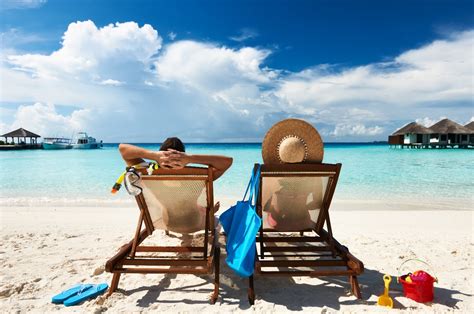 people-relaxing-on-beach - Arbor Dental Care