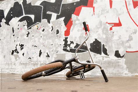 "Bicycle At Graffiti Wall" by Stocksy Contributor "Danil Nevsky" - Stocksy