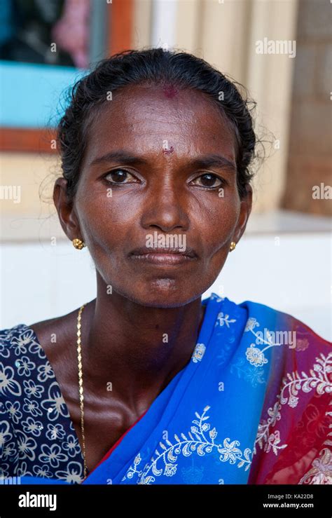 Rural residents in daily life. Closeup portrait of a dark-skinned Indian woman waiting on the ...