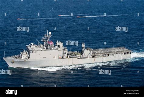 The U.S. Navy Harpers Ferry-class amphibious dock landing ship USS Pearl Harbor steams off the ...