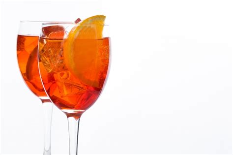 Premium Photo | Aperol spritz cocktail in glass on white wall