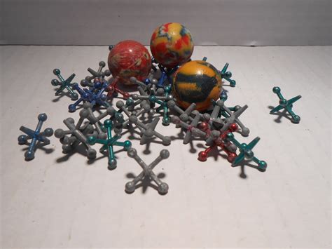 Vintage Antique Metal Toy Jacks Game 3 Balls and 39 Jacks -- Antique Price Guide Details Page