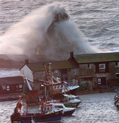 Storms red alert: Britain's coast battered by 30ft waves, high tides, giant hailstones as one of ...