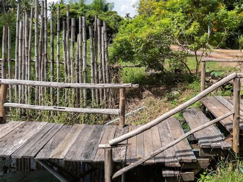 Premium Photo | The wooden bridge along the small pond