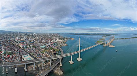 Cebu City, Philippines - Panoramic aerial of the Metro Cebu Skyline and Cebu - Cordova Bridge ...