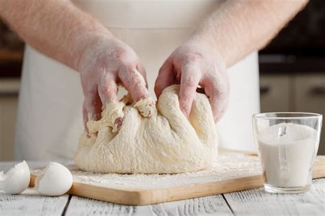 Premium Photo | Hands kneading a dough