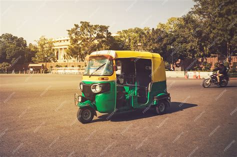 Premium Photo | Moto-rickshaw, new delhi, india. indian taxi stands on the street against ...