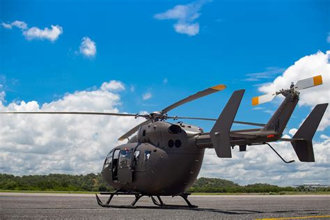 Gray Helicopter on Gray Concrete Pavement Under Blue Sky · Free Stock Photo