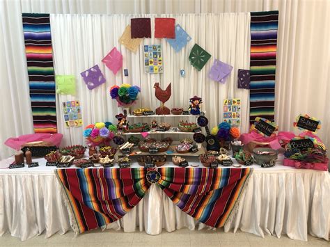 a table covered in lots of colorful items and decorations for a mexican ...