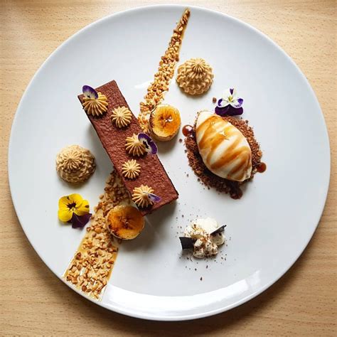 Chocolate ganache cake•toffee cream•caramelized banana•toffee/granola soil•tosted hazelnut ice ...