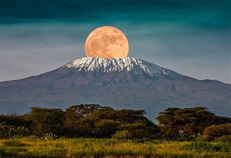 The full moon rises over Mount Kilimanjaro, Tanzania, Africa. February 19, 2019. : r/pics