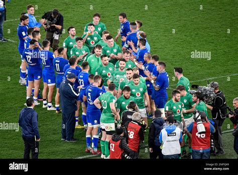 Players of Italy and Ireland greet each other at the end of the Six Nations rugby match between ...