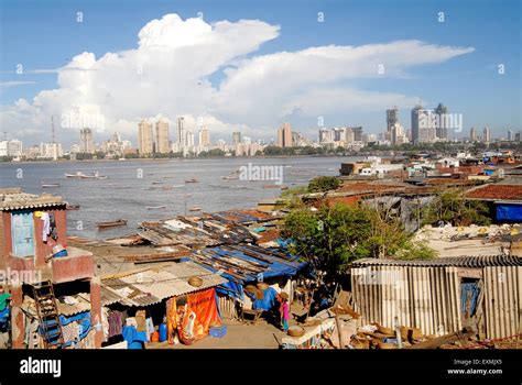 Huts and background city skyline ; Worli Village ; Worli Koliwada ; Worli ; Bombay ; Mumbai ...