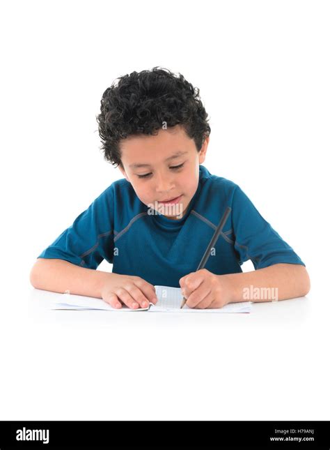 Young Boy Writing His Homework Isolated on White Background Stock Photo - Alamy