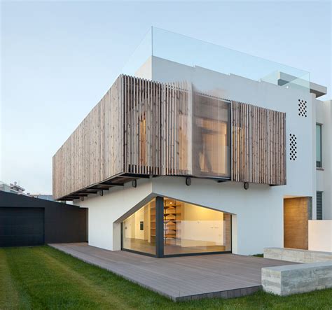 e|348 arquitectura screens house in miramar with operable facade