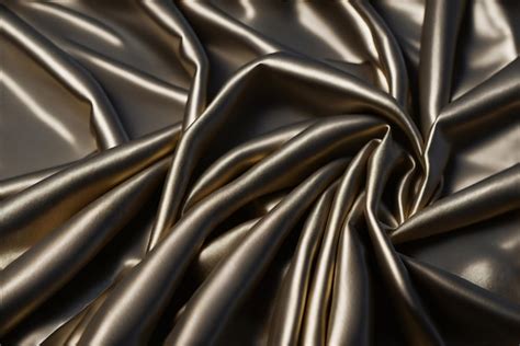 Premium AI Image | A close up of a silk fabric with a black fabric texture.